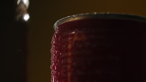 Close-Up-Backlit-Shot-Of-Condensation-Droplets-On-Revolving-Takeaway-Cans-Of-Cold-Beer-Or-Soft-Drinks